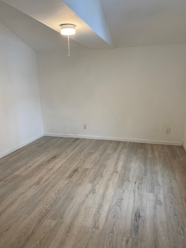 spare room featuring light wood-type flooring