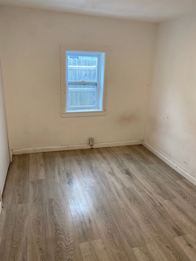 spare room with light wood-type flooring