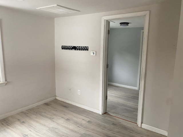 1095 Harding Dr, Grand Blanc, MI 48507 - unfurnished room featuring wood finished floors and baseboards