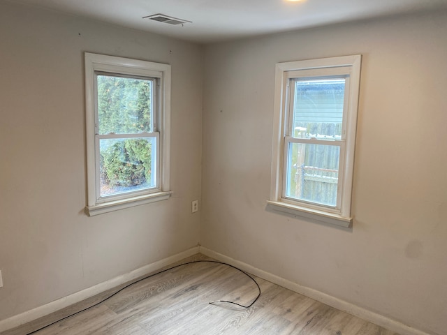 empty room featuring wood-type flooring