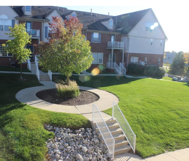 view of home's community with a lawn