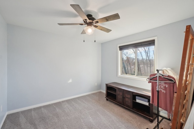 interior space with light carpet and ceiling fan