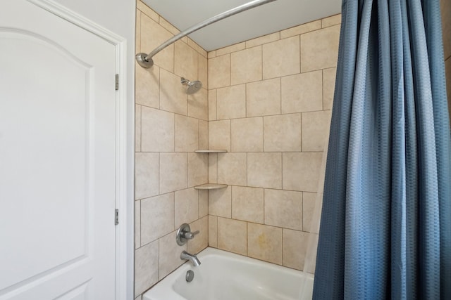 bathroom featuring shower / tub combo with curtain