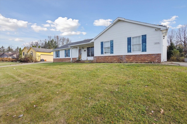 ranch-style home with a front lawn