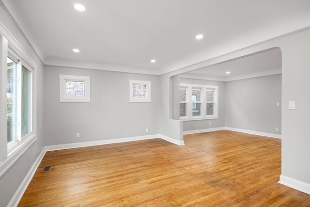 empty room with light hardwood / wood-style flooring