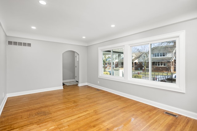 spare room featuring light wood-type flooring