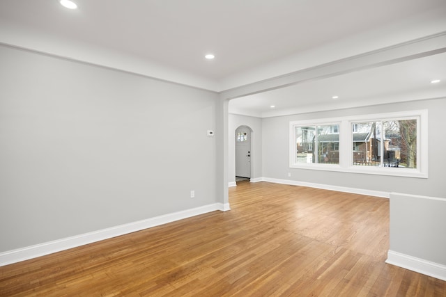 spare room featuring light hardwood / wood-style flooring