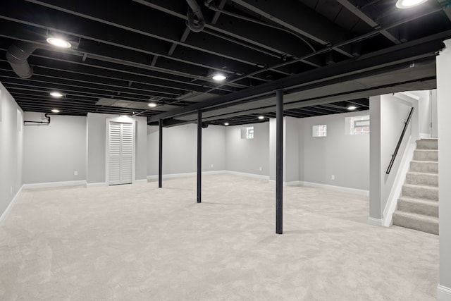 basement with light colored carpet