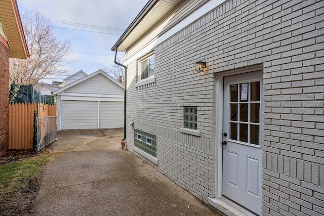 view of side of home featuring an outbuilding and a garage