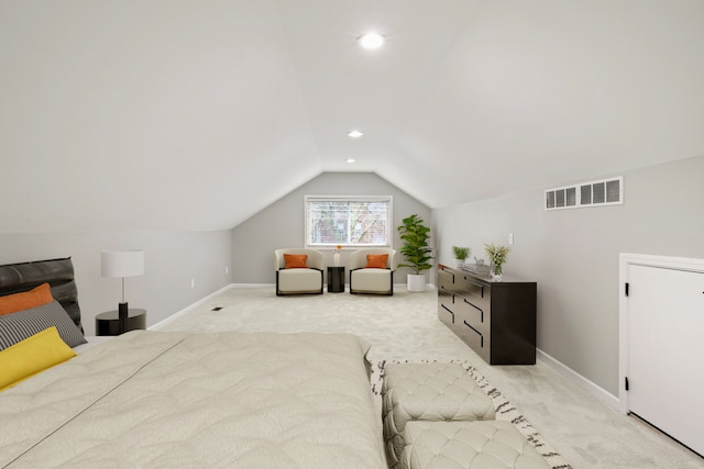 carpeted bedroom featuring vaulted ceiling