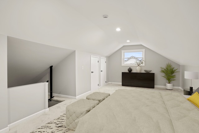 carpeted bedroom featuring vaulted ceiling