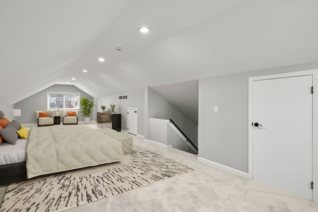 carpeted bedroom with vaulted ceiling