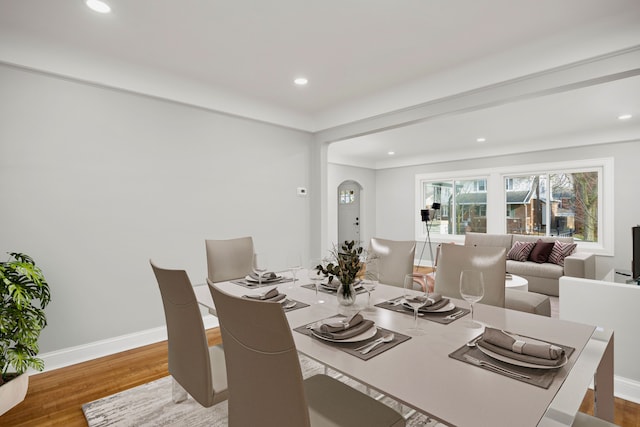 dining space with hardwood / wood-style floors