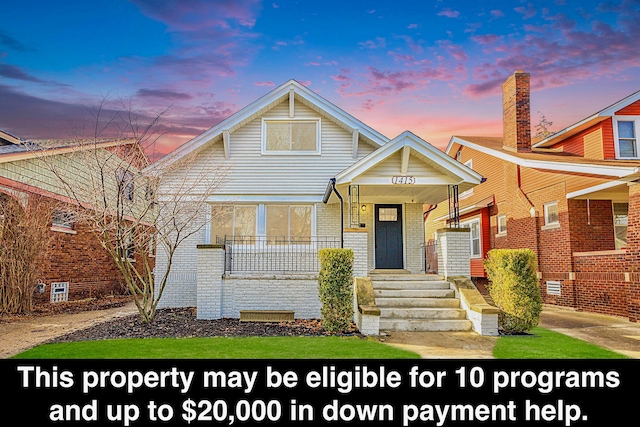 view of front of property featuring covered porch