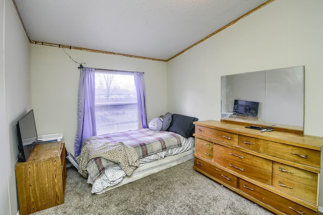 carpeted bedroom featuring a textured ceiling