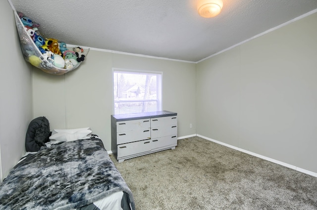 carpeted bedroom featuring a textured ceiling and crown molding