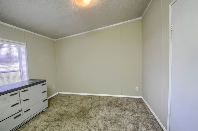 unfurnished bedroom with carpet flooring, a textured ceiling, and ornamental molding