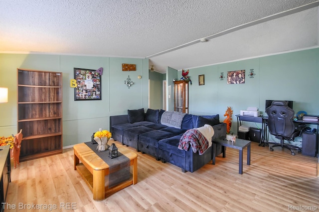 2350 Iowa Ave, Saginaw, MI 48601 - living room featuring a textured ceiling, wood finished floors, a desk, and ornamental molding