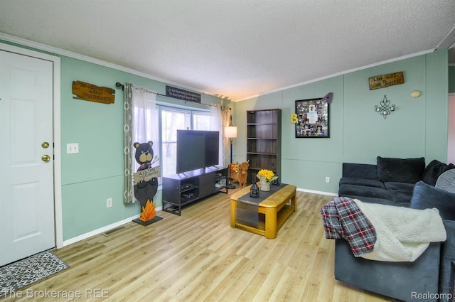 2350 Iowa Ave, Saginaw, MI 48601 - living area with crown molding, wood finished floors, and a textured ceiling