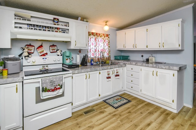 kitchen featuring white range with electric cooktop, white cabinetry, and sink