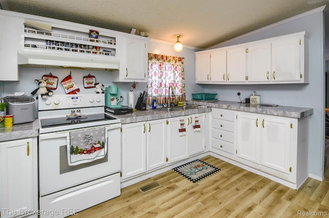 2350 Iowa Ave, Saginaw, MI 48601 - kitchen featuring electric stove, crown molding, a textured ceiling, lofted ceiling, and white cabinets
