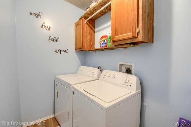 2350 Iowa Ave, Saginaw, MI 48601 - laundry area with cabinet space and washing machine and dryer