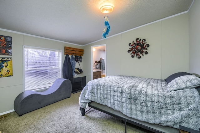 bedroom featuring lofted ceiling, ensuite bathroom, carpet flooring, ornamental molding, and a textured ceiling