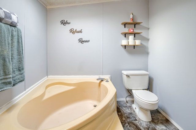 bathroom featuring toilet and a bathtub