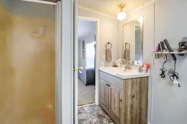 bathroom featuring a textured ceiling, vanity, walk in shower, and vaulted ceiling