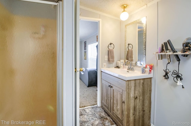 2350 Iowa Ave, Saginaw, MI 48601 - bathroom with vanity, crown molding, a textured ceiling, and a shower with shower door