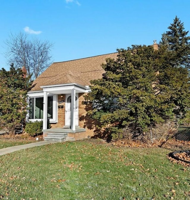 view of front of home with a front yard