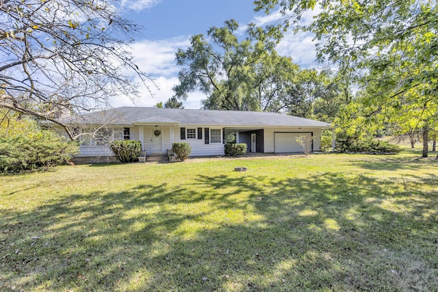 single story home featuring a front lawn and a garage