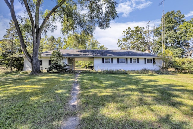 single story home with a front lawn and a carport