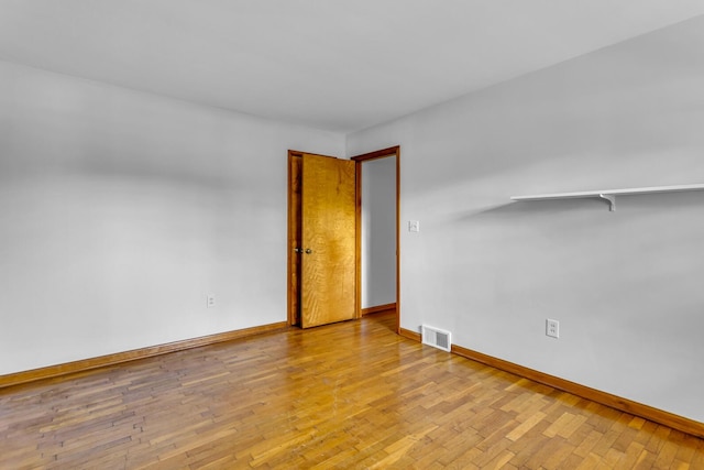 spare room with light hardwood / wood-style floors