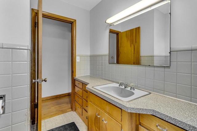 bathroom with tile patterned flooring and vanity