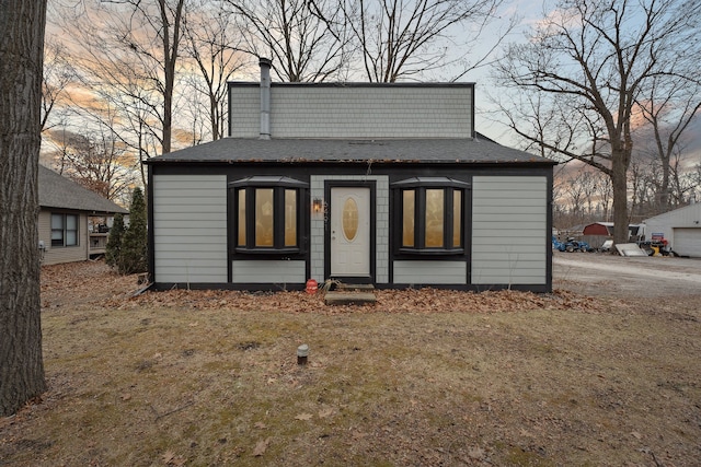 outdoor structure at dusk with a lawn