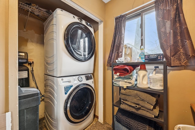 laundry area featuring stacked washer and clothes dryer