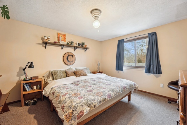 carpeted bedroom with ceiling fan and a textured ceiling