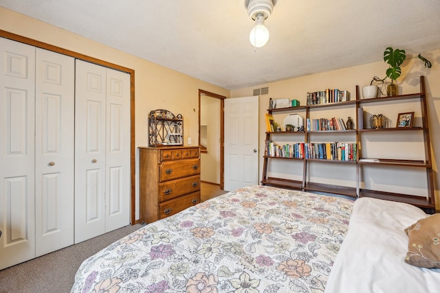 bedroom featuring carpet and a closet