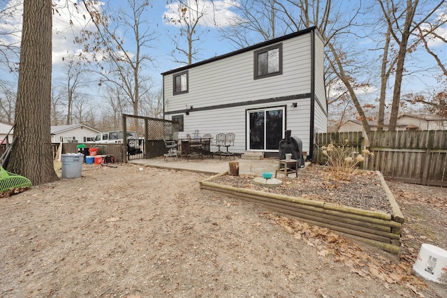 rear view of property with a patio area