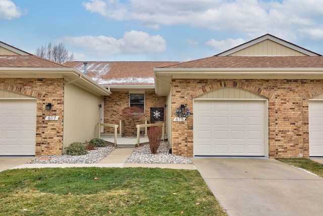 single story home with a front yard and a garage