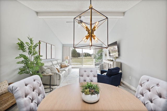 dining room with lofted ceiling with beams and an inviting chandelier