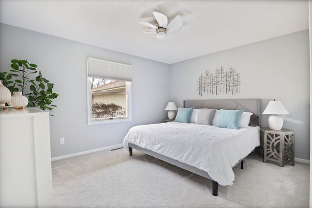 bedroom featuring ceiling fan and carpet