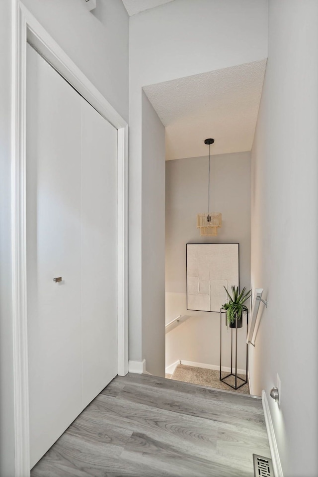 hallway featuring light hardwood / wood-style flooring