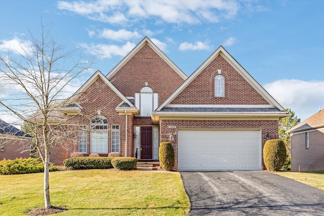 front facade with a front yard and a garage