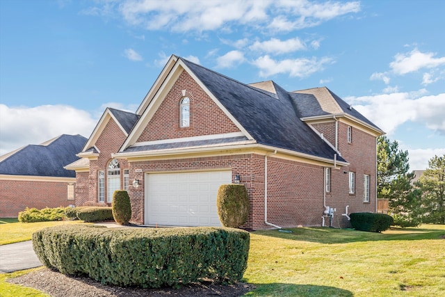 view of front facade featuring a front yard and a garage