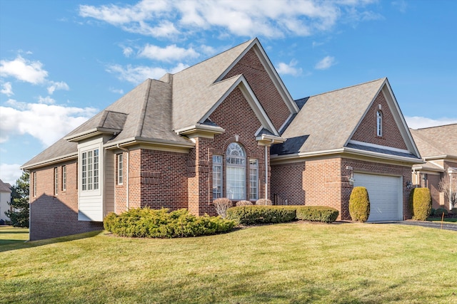 view of front facade featuring a front yard and a garage