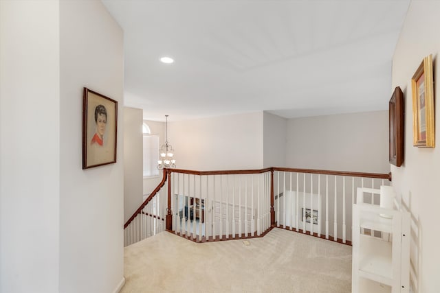 corridor featuring carpet and an inviting chandelier