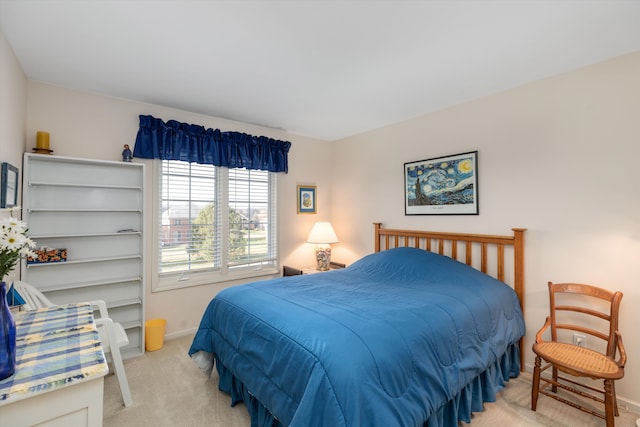 bedroom featuring light colored carpet