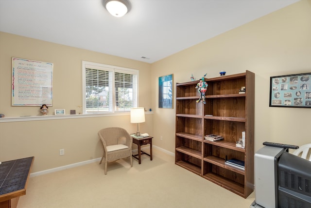 living area featuring light carpet